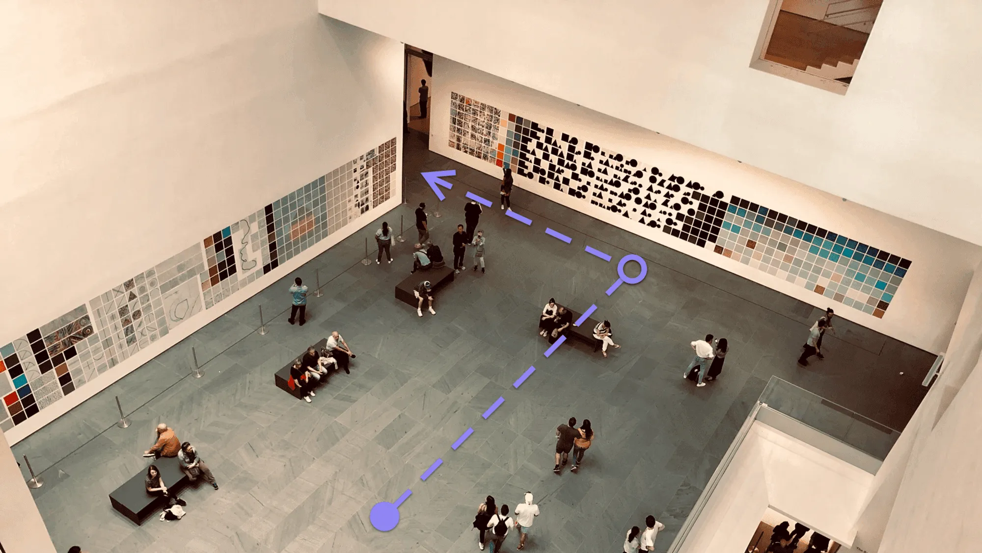 An overhead view of a gallery with a route drawn from Angela to the next artwork